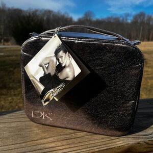 Donna Karan cosmetics silver bag